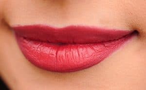 wear red lipstick to hide bruise after dermal filler cosmetic treeatment